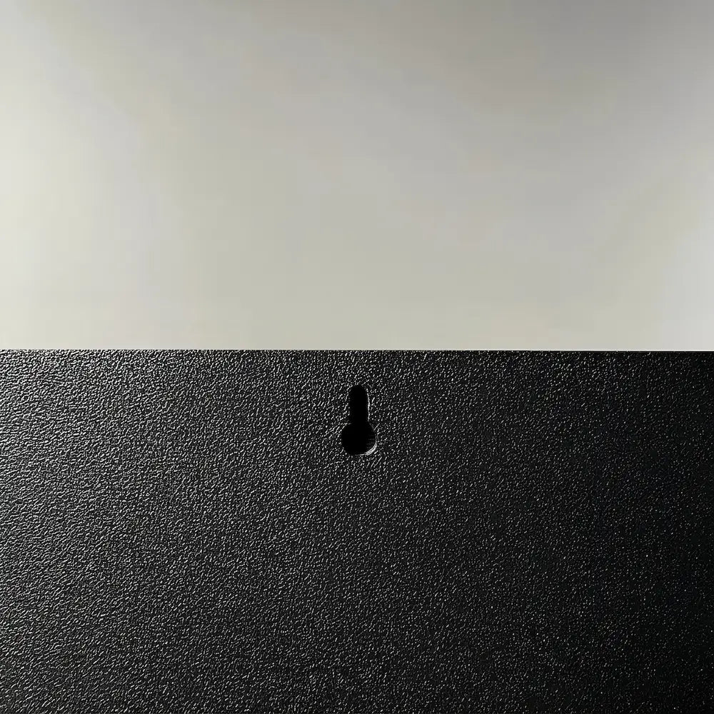 art photo of the back side of a black picture frame