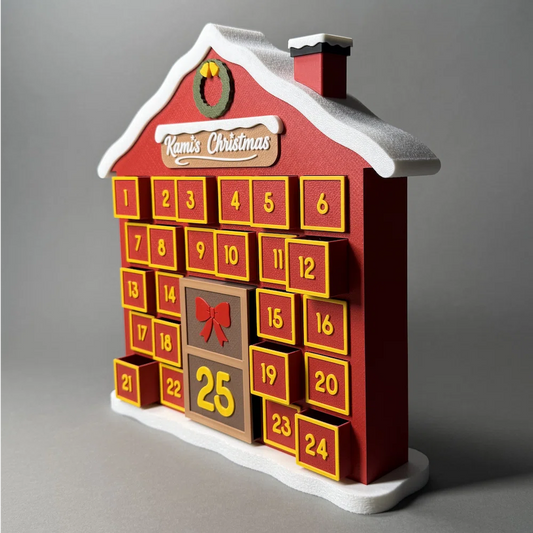 Red 3d printed house-shaped advent calendar with yellow numbers